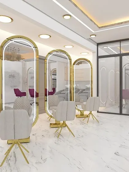 The hair styling section of our salon, featuring full-length mirrors with integrated lighting and modern, comfortable chairs.