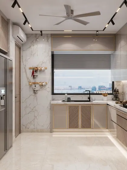 This view shows the kitchen's large window, which floods the space with natural light. The design combines light-colored cabinetry with a marble-patterned wall for a bright and airy feel.