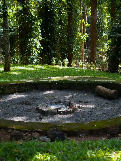 For this project in a wooded area, I designed a rustic, circular fire pit with a stone border, creating a natural gathering spot for evenings outdoors.