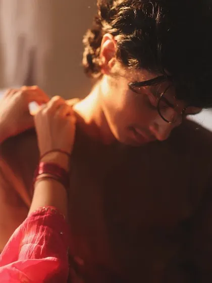 A close-up on a gesture of care. Every detail in this frame, from the touch on the shoulder to the soft drape of the clothing, was part of the visual narrative I directed to convey intimacy and grace for the Studio Nirjara brand.