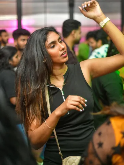 Hands in the air, feeling the music. The rooftop vibe at GoWild was amazing.