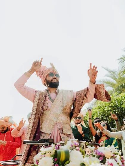 The groom leading the Baraat as a DJ on a vehicle, a modern and fun twist on a classic tradition.
