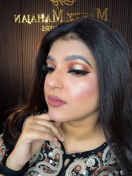 A close-up of the soft glam look, highlighting the glowing skin and sharp winged liner.