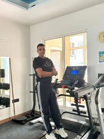 Leaning on the treadmill after a run.