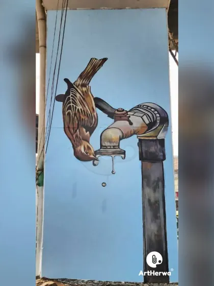 A poignant mural of a thirsty bird drinking from a dripping tap, raising awareness about water conservation.