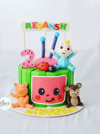 Another take on the Cocomelon theme, this time with a square watermelon TV and other beloved characters for a second birthday.