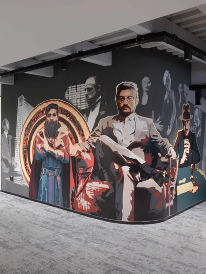 A similar view of 'The Bosses' mural, capturing the unique and personalized art that defines the Centrix office culture.