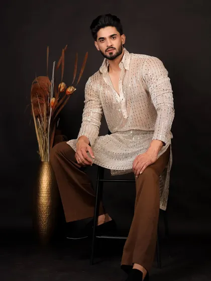 A more serious and direct pose, showing versatility for a men's ethnic wear lookbook.