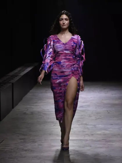 A soft glam look for a FAD International fashion show. The makeup is dewy and radiant, with glossy lips to complement the colorful, flowing dress.