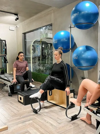 Finding balance and calm through diaphragmatic breathing. Our clients use the magic circle to deepen their core connection.