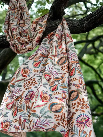 Our Ethereal Elegance fabric collection tells a story of skilled artistry. Woven from premium natural fibers, it features intricate handcrafted embroidery with vibrant florals and graceful birds, perfect for creating statement curtains or upholstery.