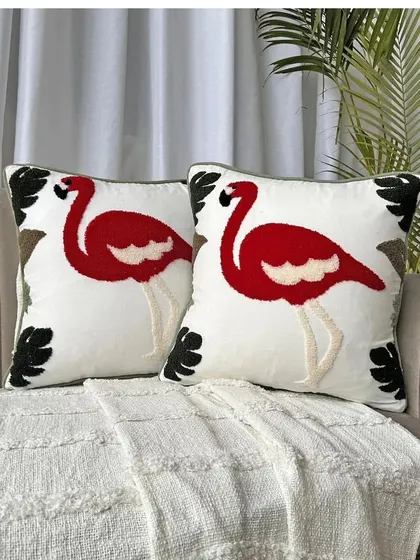 Make a bold statement with our red flamingo embroidered cushion cover. This tropical-themed design is perfect for adding a pop of color and fun to your decor.