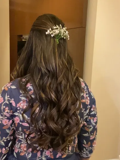 Soft, bouncy curls are perfect for a romantic half-up, half-down hairstyle. Here, I've added a simple baby's breath accessory.