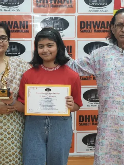 A student with her mother and guru, a proud family moment.