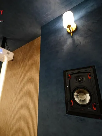 A close-up of an Episode Signature in-wall speaker, known for its exceptional audio clarity. I use high-quality components like this to build truly immersive soundscapes.