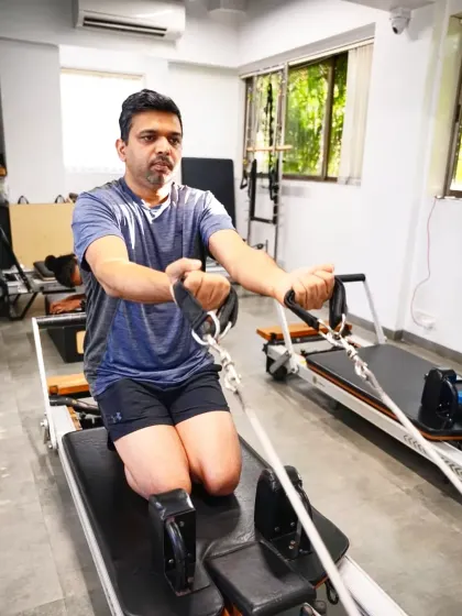 Real strength is about control and balance. This client builds core power and improves flexibility on the reformer, enhancing his performance both in and out of the gym.