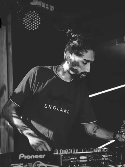 A black and white shot capturing my focus during a techno night. The mood is different, but the goal is the same: create an immersive sound experience.