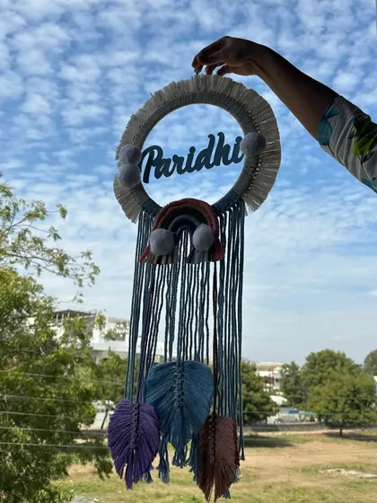 Another look at the 'Paridhi' dreamcatcher, showcasing the handcrafted details. We can create these name hangings in any color combination to suit your home decor or nursery theme.