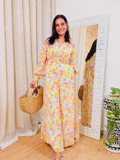 A beautiful floral flared jumpsuit that looks like a maxi dress. The wrap-style top and full sleeves make it very elegant.