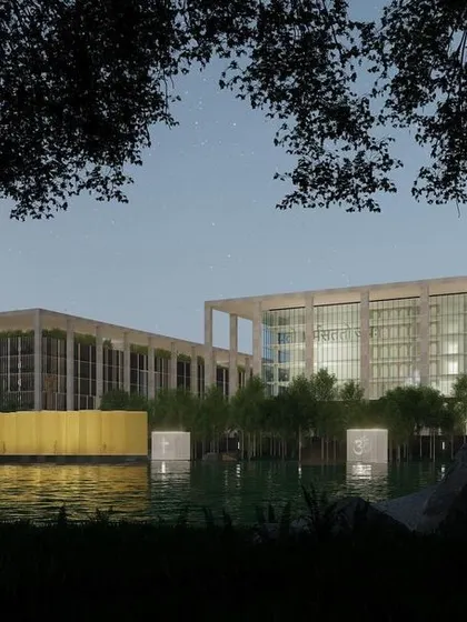 A dusk view of the Telangana High Court proposal. The lighting strategy was designed to highlight the building's strong architectural form and its relationship with the water, creating a respectful and serene presence in the landscape even after dark.