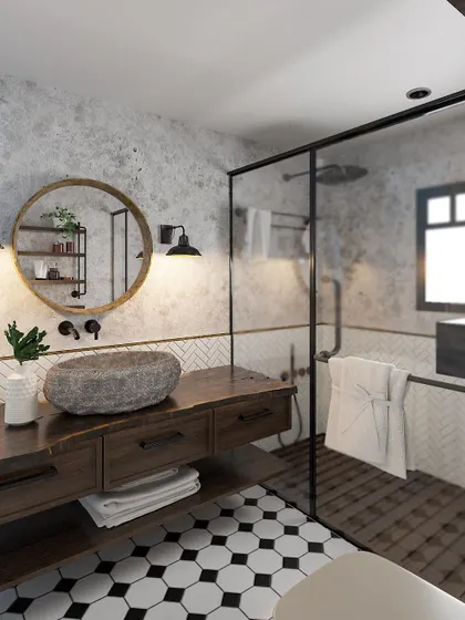Another angle of the earthy bathroom, highlighting the round mirror and industrial-style wall sconces.