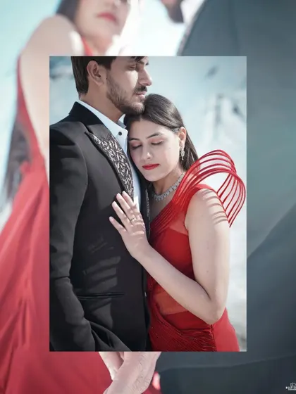 An intimate close-up of the couple in the snow, the bride in a vibrant red dress, capturing a tender moment of connection.