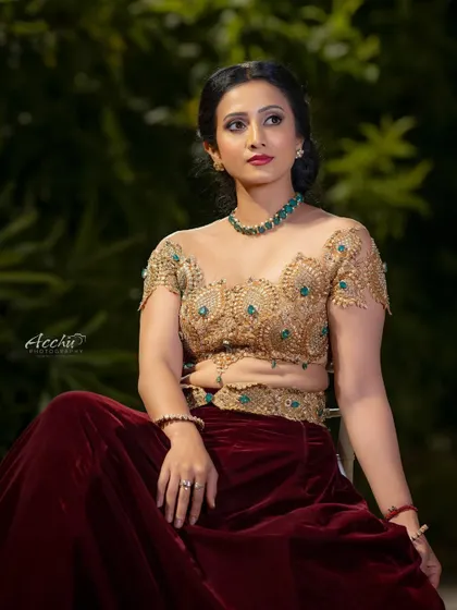 Another angle of this magnificent outfit, focusing on the detailed craftsmanship of the blouse. The lighting is soft, letting the outfit's details shine.