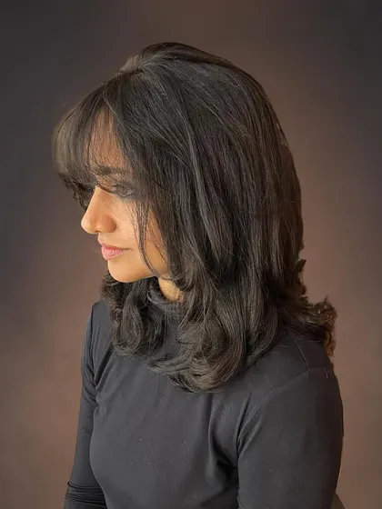 A side view of the wispy bangs and layers.