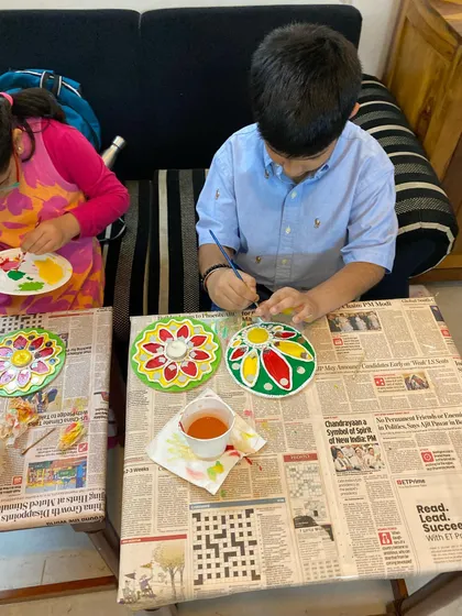Here are two of my students busy painting their Lippan Art tea light holders for Diwali. It is so rewarding to see them engaged in a traditional art form, using their hands and imagination to create something special.