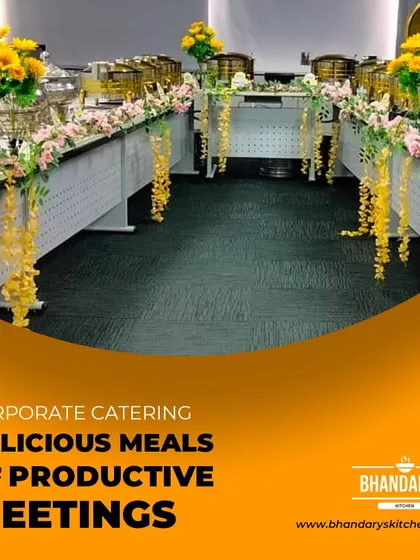 This U-shaped buffet arrangement is perfect for corporate meetings where space is optimized for flow. The setup, decorated with yellow and pink floral arrangements, ensures guests can easily access the food from multiple points, making for a productive and delicious meeting.