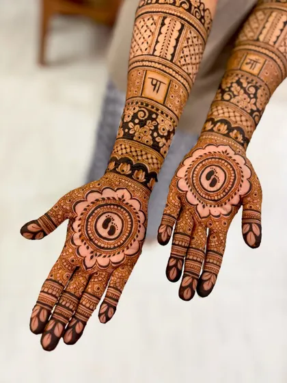 A close-up of the palm designs, showing the delicate baby feet motif.