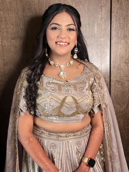 The complete look for Aayushi's engagement. The makeup is glamorous yet soft, letting her natural beauty shine through.