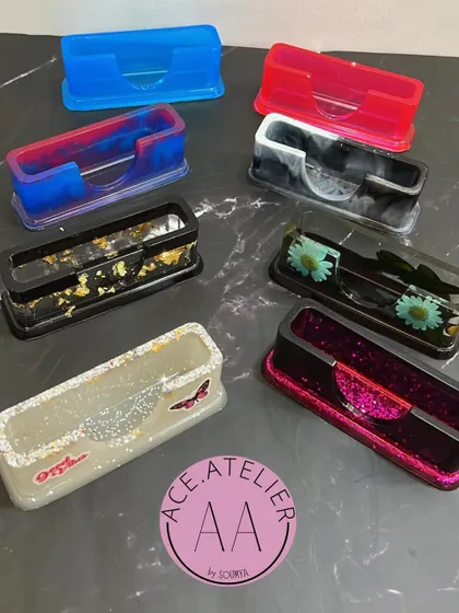 A collection of my custom resin card holders in various colors and styles. They are a stylish and modern alternative to basic card holders.