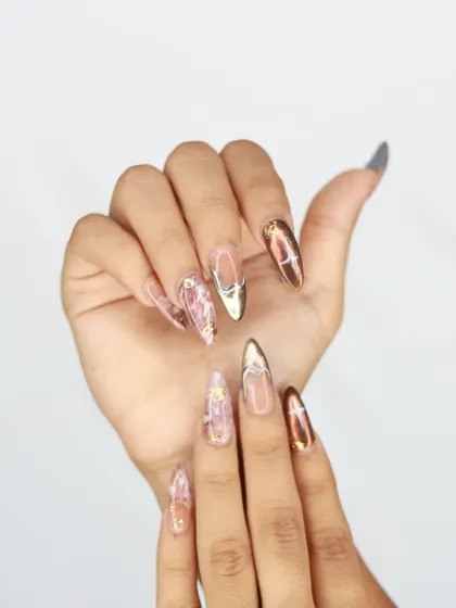 Another angle of the artistic pink marble and chrome nail set.