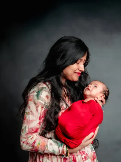 A mother's embrace is a world of its own. I love capturing the warmth and love in a mother's gaze as she holds her new baby.