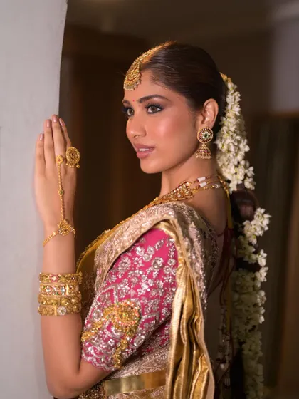 An unedited, raw portrait of this beautiful South Indian look. The focus is on clean, glowing skin and softly defined eyes, proving that you don't need filters to look stunning.