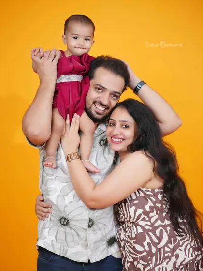Our family, our happy place. A bright and cheerful studio backdrop makes the love in this family shine.