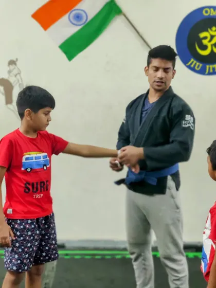 A student receiving his well-earned stripe. This promotion recognizes his dedication to learning Jiu-Jitsu techniques and his consistent presence in class.
