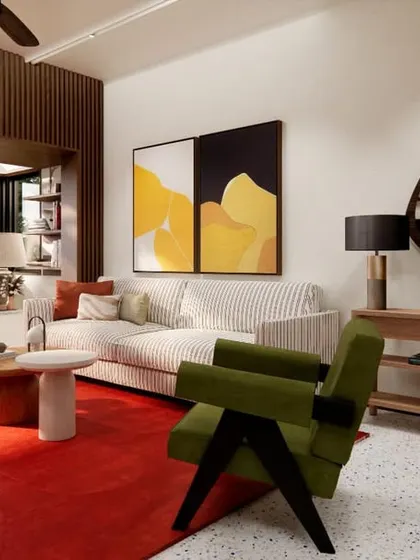 The living room in HAUS 5 is an eclectic mix of colors, textures, and forms. A bold red rug anchors the space, which features a comfortable window seat, modern art, and a mix of contemporary and classic furniture pieces.