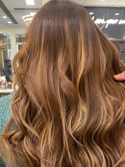 Another angle of this beautiful honey-blonde balayage, showing the consistency and expert blending from a different view.