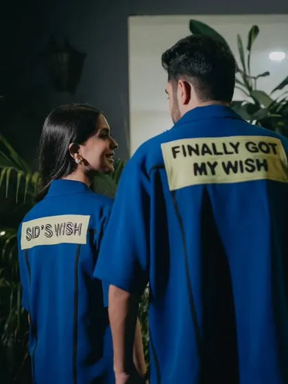 A fun and personal touch with the couple wearing custom shirts that say "Sid's Wish" and "Finally Got My Wish," showcasing their playful love story.