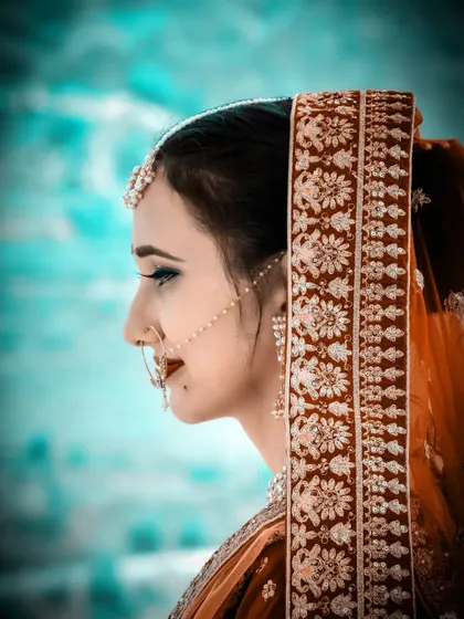 A stunning side profile of the bride. The editing and color grading give this portrait a very cinematic and modern feel.