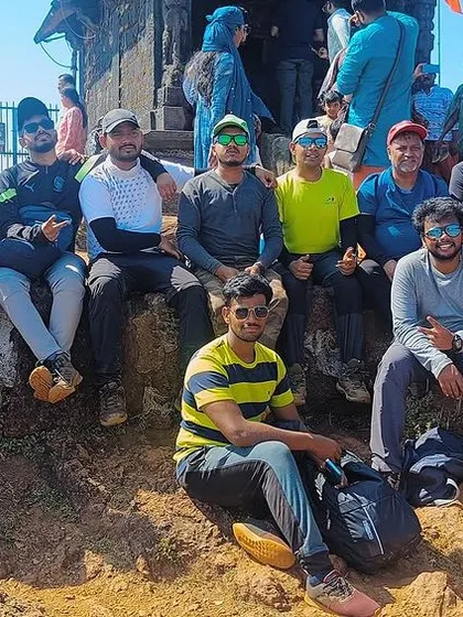 Resting at the summit after a tough climb. These moments of shared success are what make our adventure treks so effective for team building.