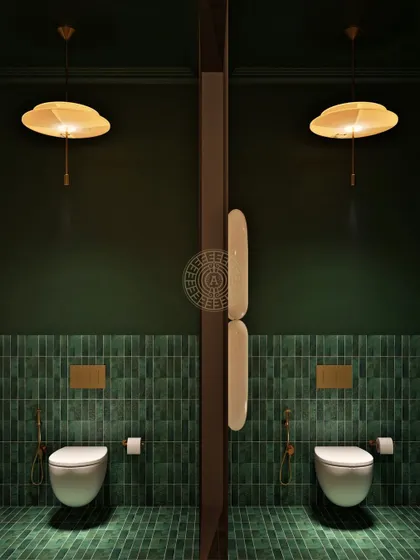A view of the men's toilet stalls at Koko, where deep green tiles and unique umbrella-style pendant lights continue the moody, sophisticated design narrative.