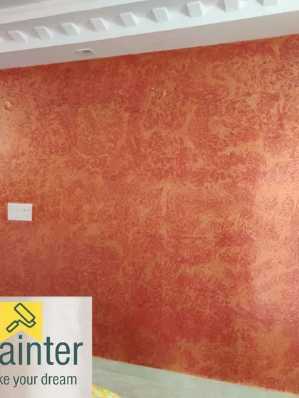 A closer look at the warm, textured wall finish, highlighting the subtle variations in color and pattern created by the application technique.