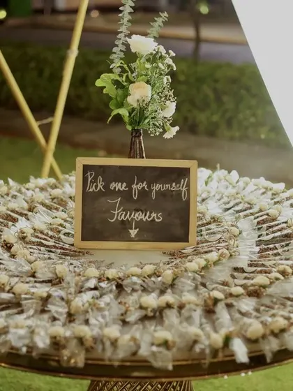 Thoughtful favors for the guests. We arranged these beautifully packaged Mehendi favors on a platter, ready for guests to take home a small piece of the celebration.
