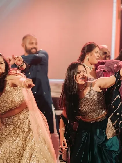 The bride and her friends owning the dance floor during a high-energy Sangeet performance.