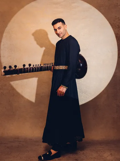 Another full-length portrait, holding the sitar like a modern-day troubadour.
