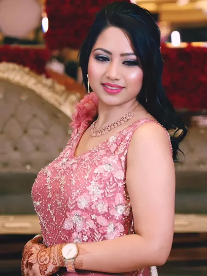 A beautiful solo portrait of the bride-to-be in her pink gown at her engagement party.