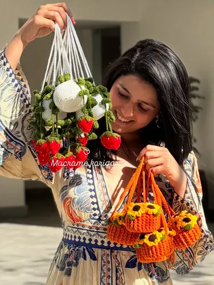 A closer look at the details of our hanging pot charms. Each flower and strawberry is individually crocheted and attached with care.